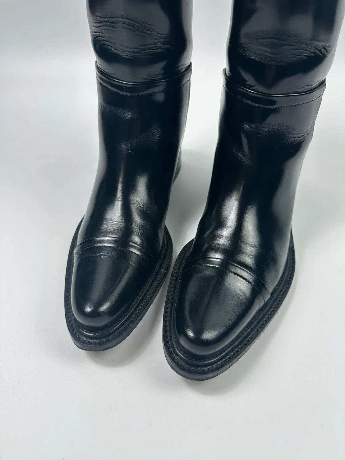 Prada black patent leather pointy toe boots with logo detail and original dustbag.