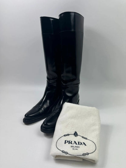 Prada black patent leather pointy toe boots with logo detail and original dustbag.