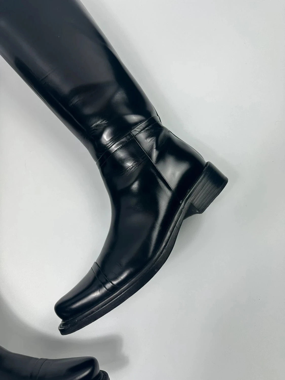 Prada black patent leather pointy toe boots with logo detail and original dustbag.