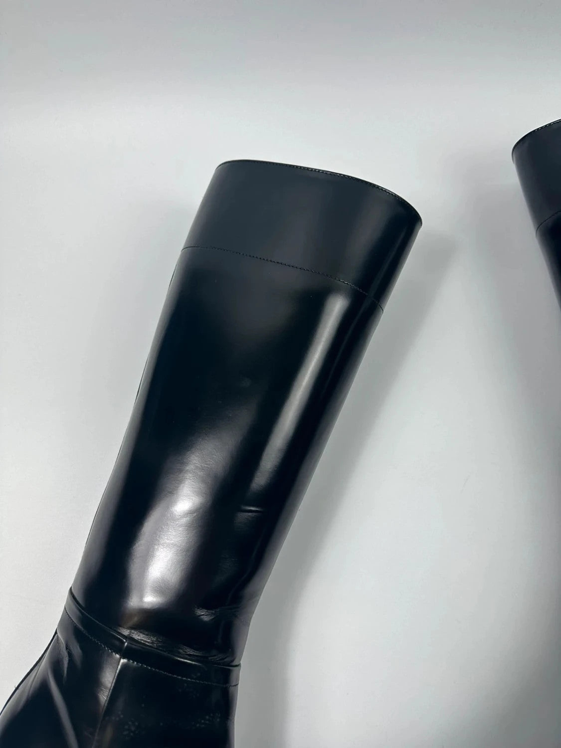 Prada black patent leather pointy toe boots with logo detail and original dustbag.