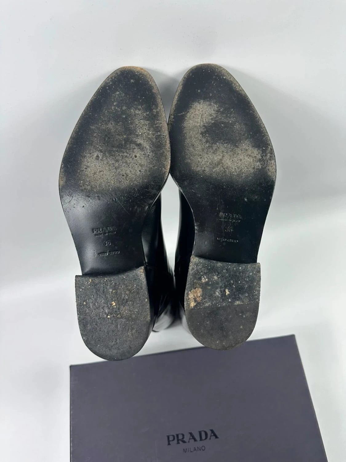 Prada black patent leather pointy toe boots with logo detail and original dustbag.