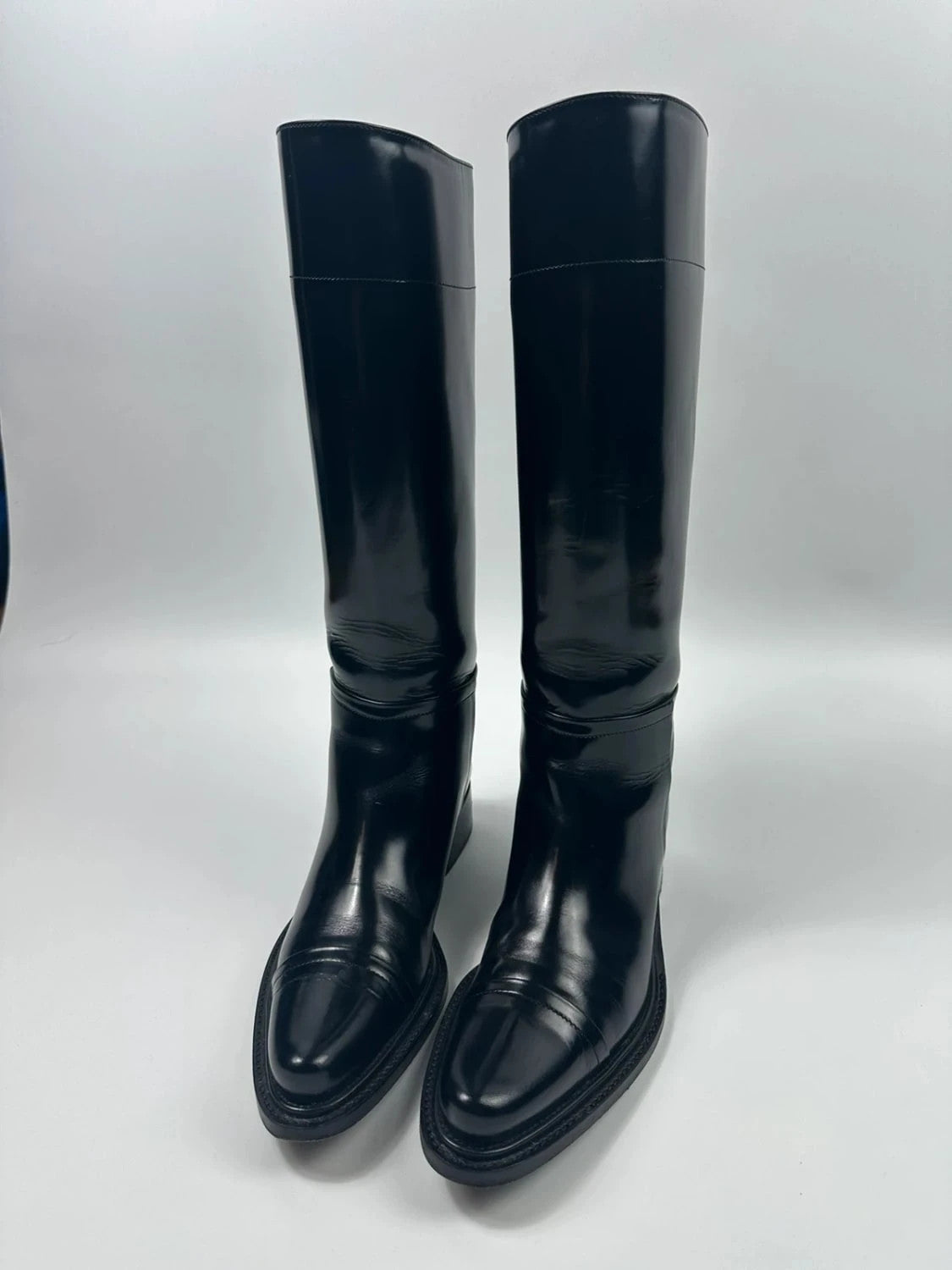 Prada black patent leather pointy toe boots with logo detail and original dustbag.