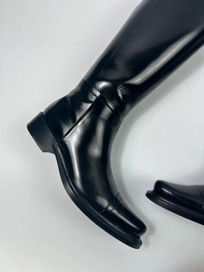 Prada black patent leather pointy toe boots with logo detail and original dustbag.