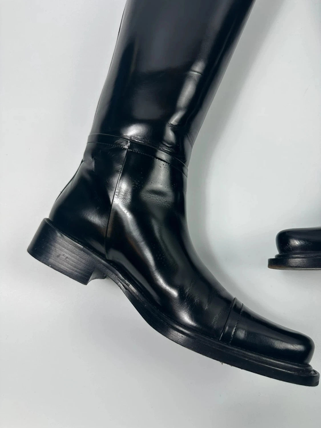 Prada black patent leather pointy toe boots with logo detail and original dustbag.