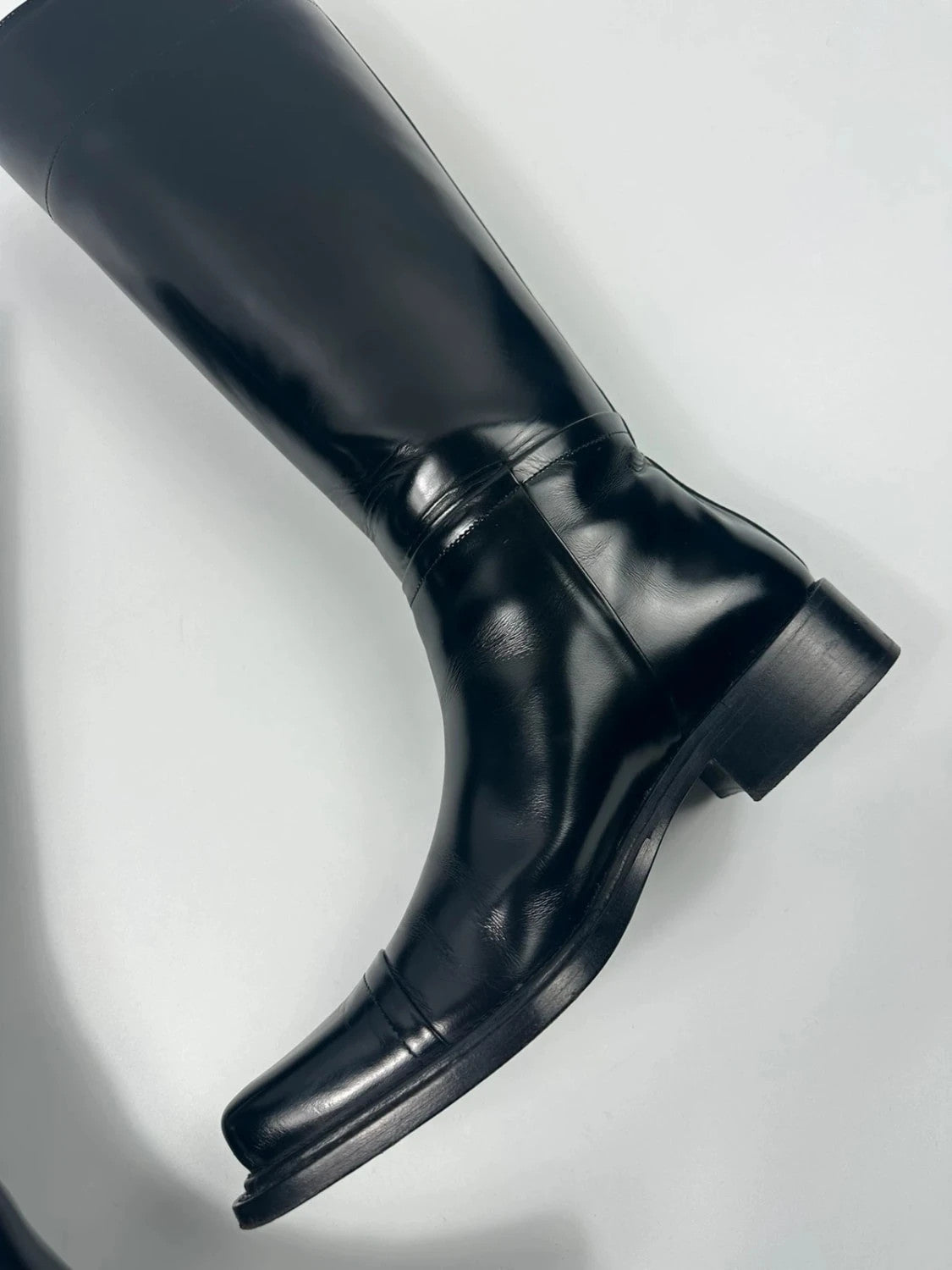 Prada black patent leather pointy toe boots with logo detail and original dustbag.