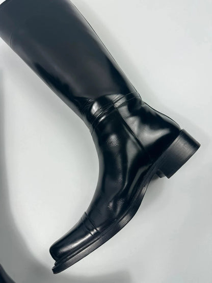 Prada black patent leather pointy toe boots with logo detail and original dustbag.