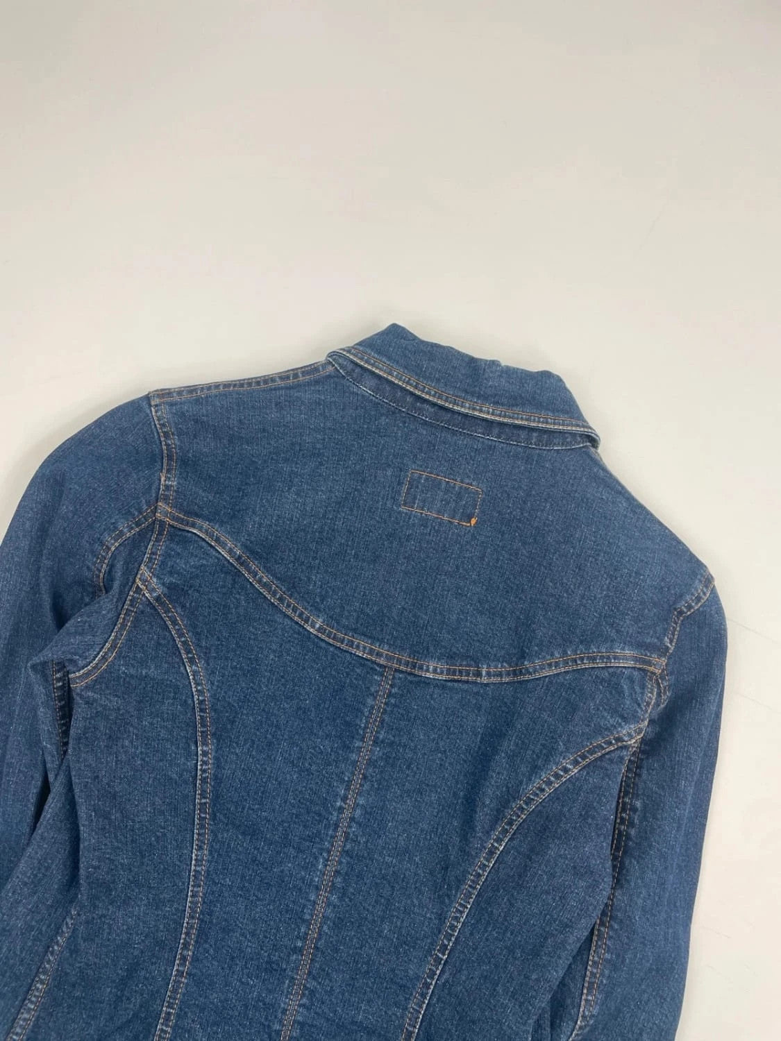 Dolce & Gabbana blue denim jacket with logo detail and vintage 2000s style.