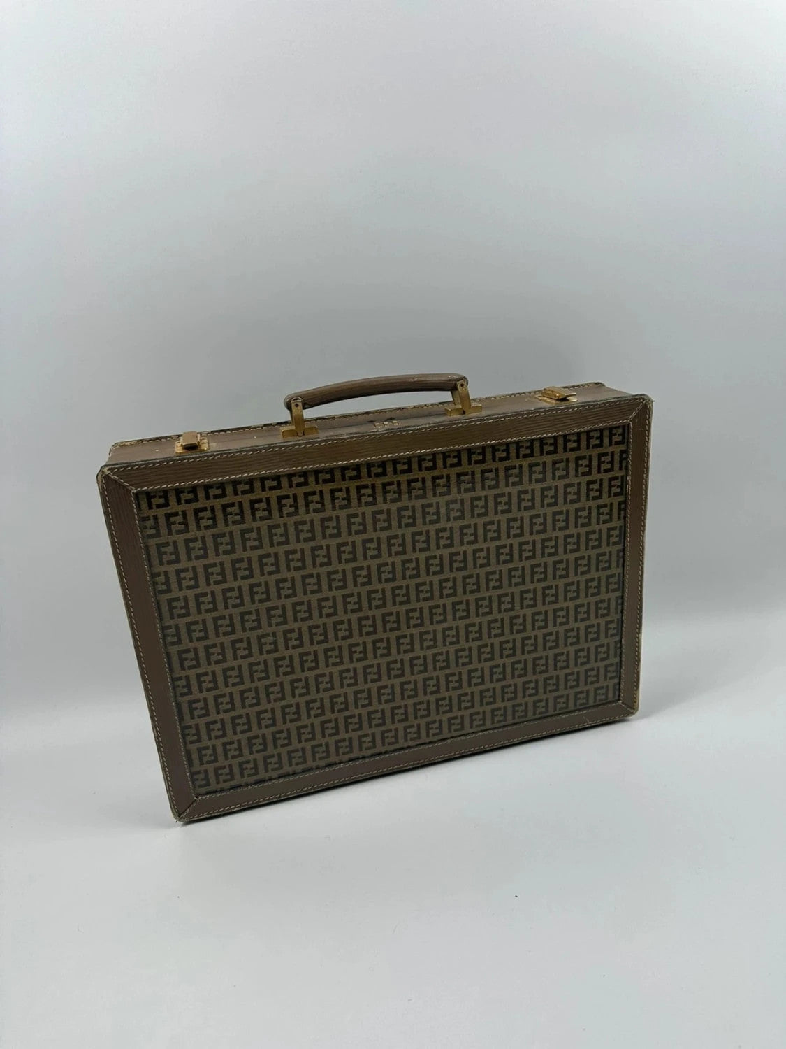 Fendi beige and brown briefcase with 70s FF monogram pattern and leather material.