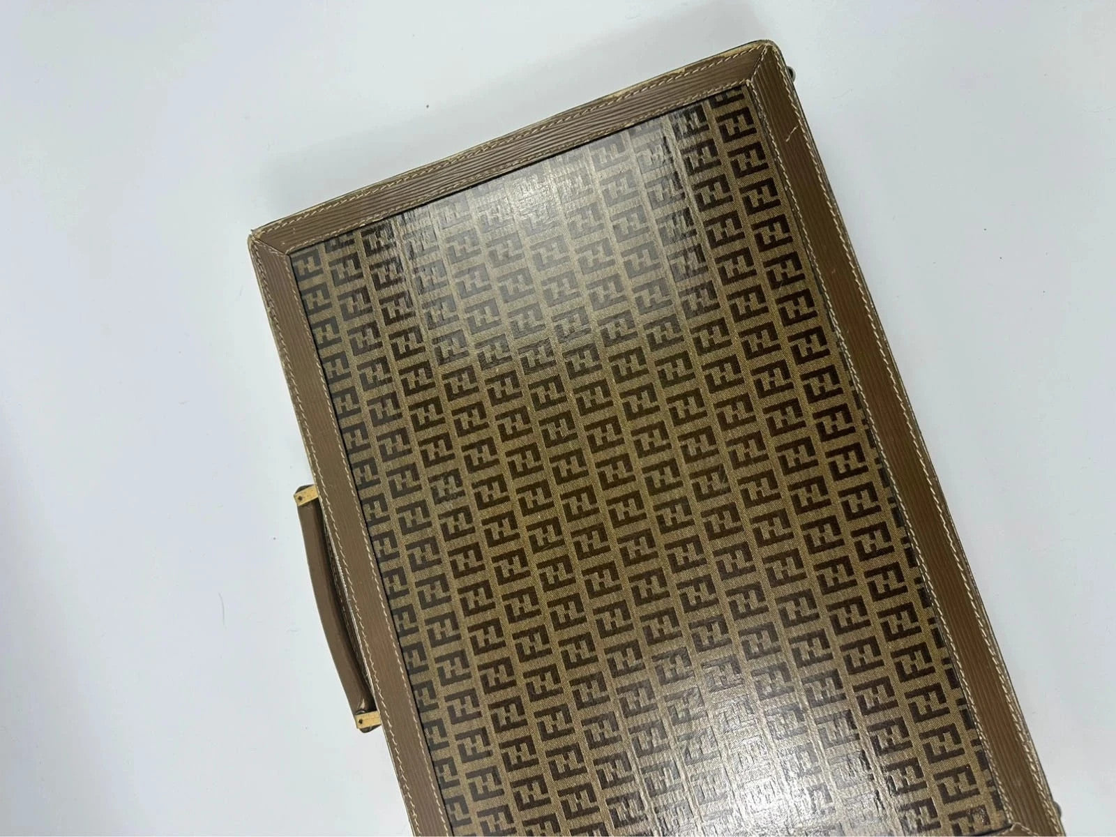 Fendi beige and brown briefcase with 70s FF monogram pattern and leather material.