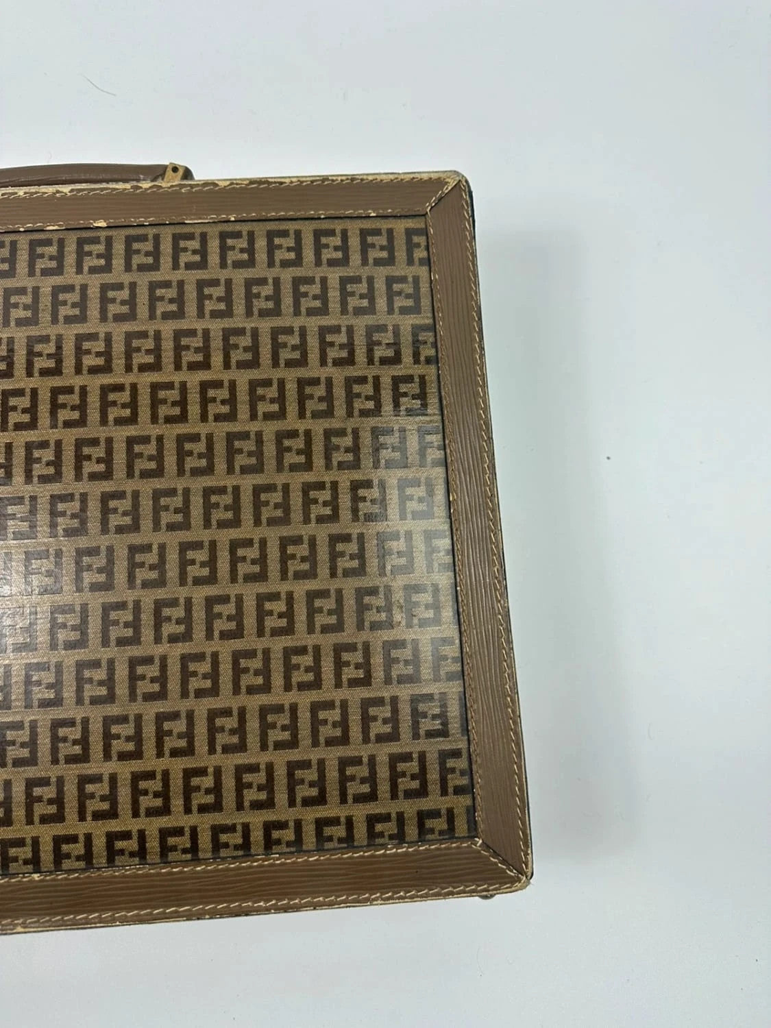 Fendi beige and brown briefcase with 70s FF monogram pattern and leather material.