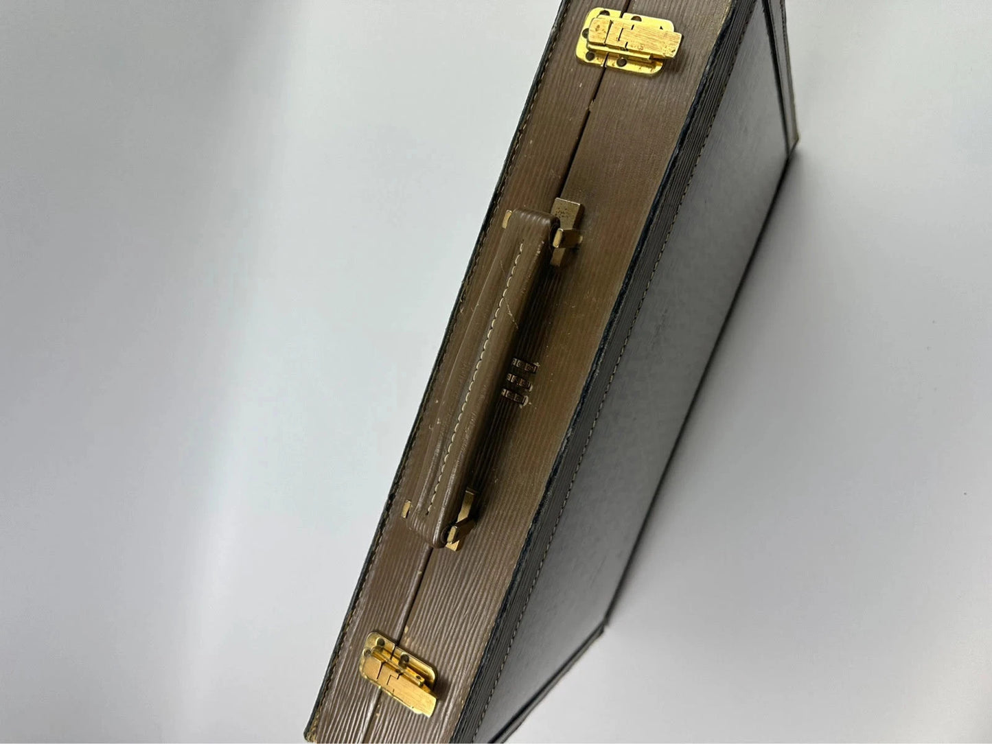 Fendi beige and brown briefcase with 70s FF monogram pattern and leather material.
