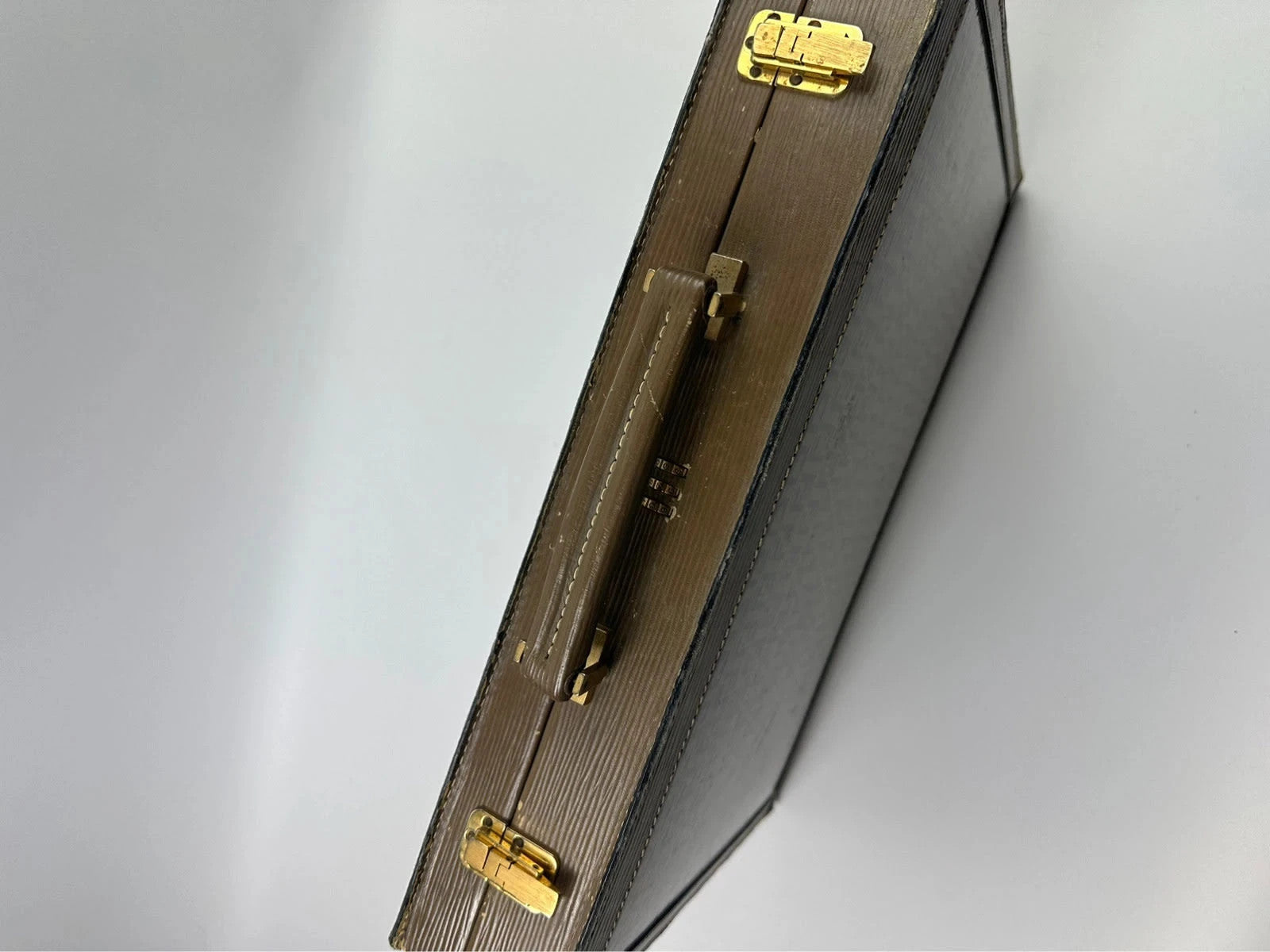 Fendi beige and brown briefcase with 70s FF monogram pattern and leather material.