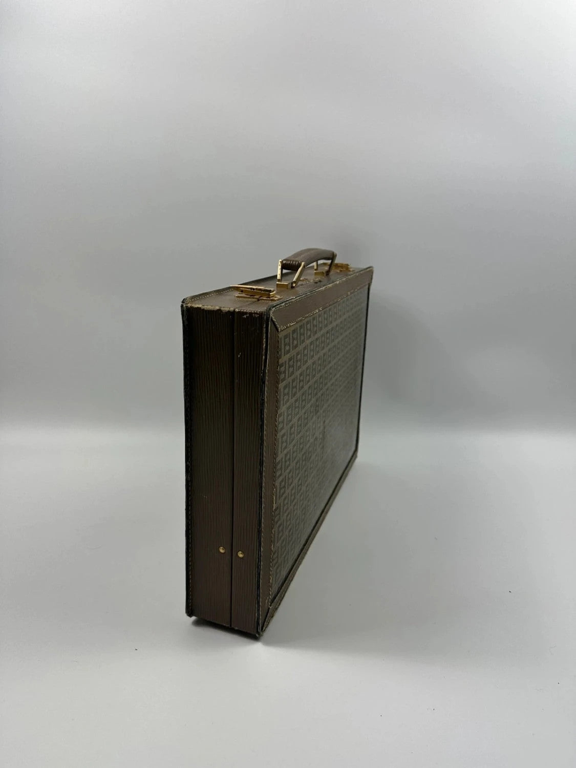 Fendi beige and brown briefcase with 70s FF monogram pattern and leather material.
