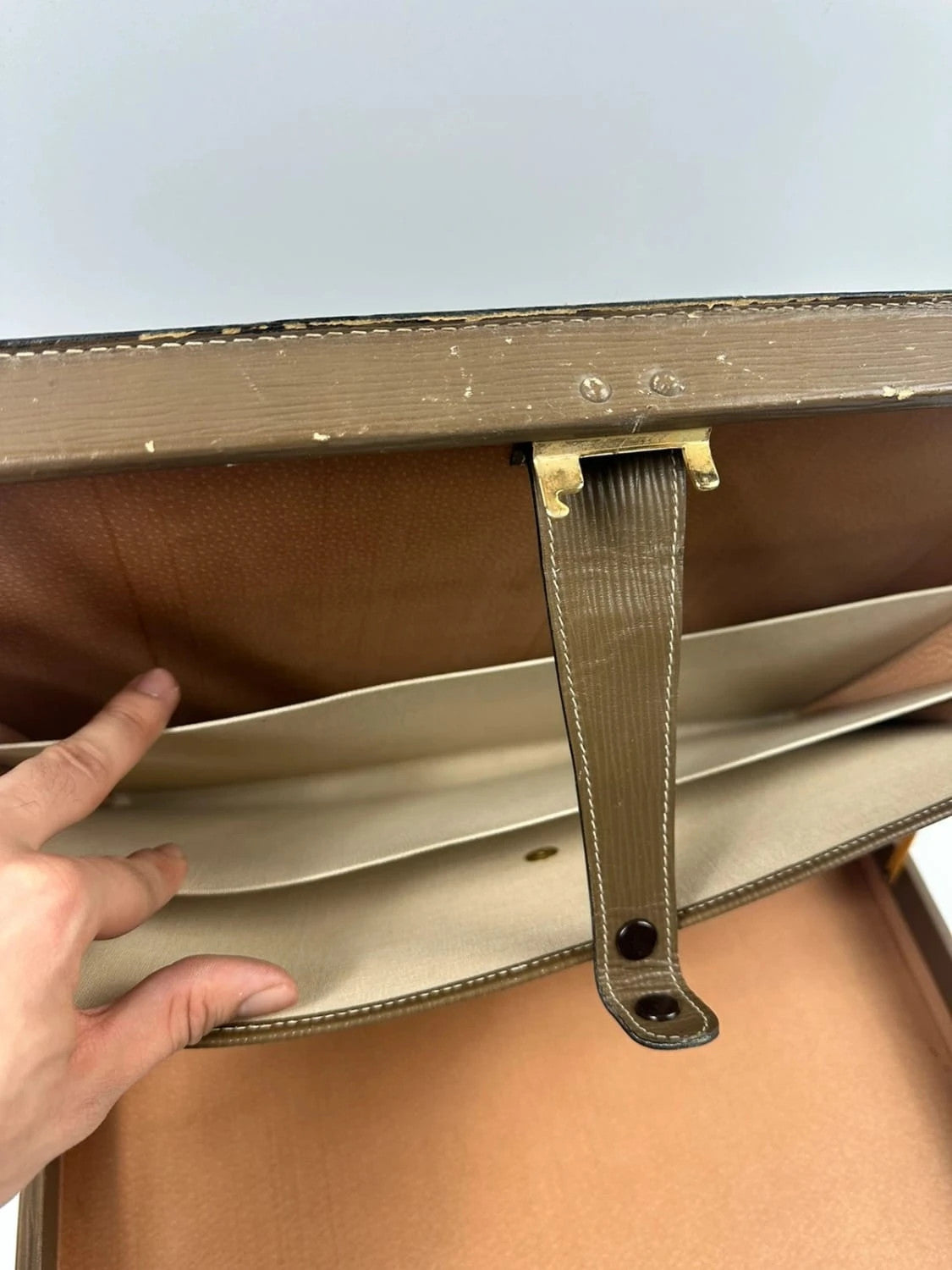 Fendi beige and brown briefcase with 70s FF monogram pattern and leather material.