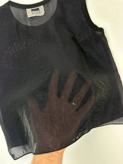 Marithé Francois Girbaud black tank top with floral laser cut details and sheer back.