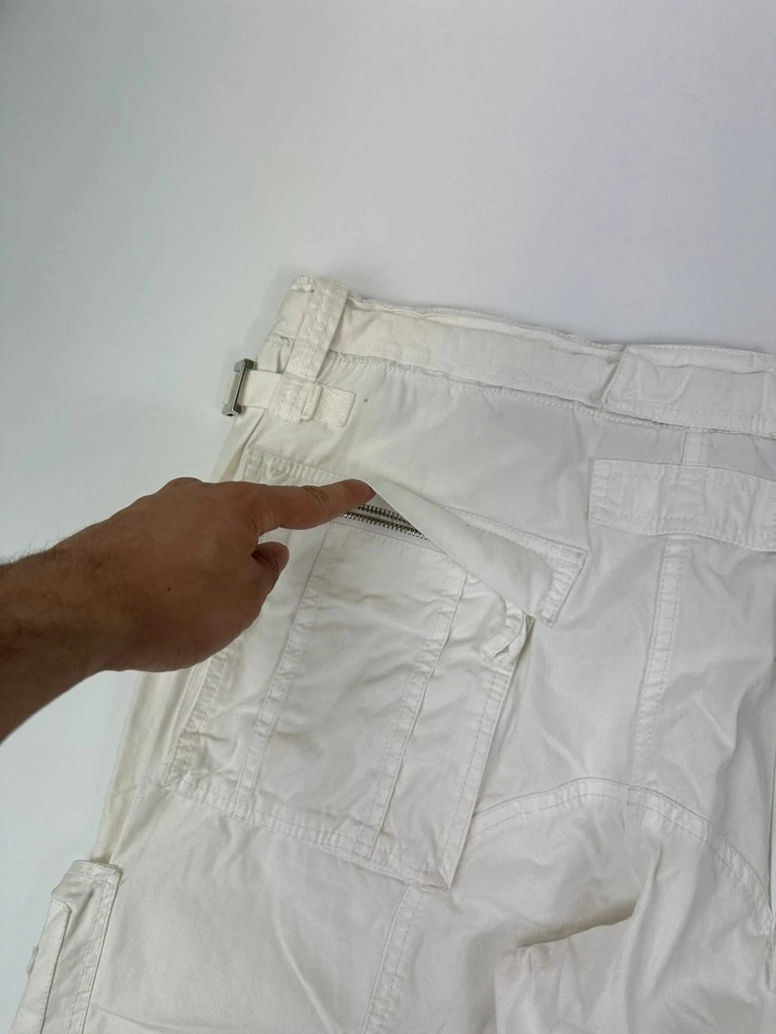Dolce & Gabbana white wide-leg trousers with multiple pockets and adjustable drawstring waist.