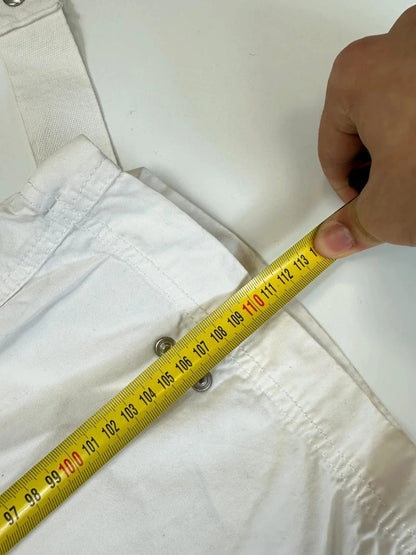 Dolce & Gabbana white wide-leg trousers with multiple pockets and adjustable drawstring waist.