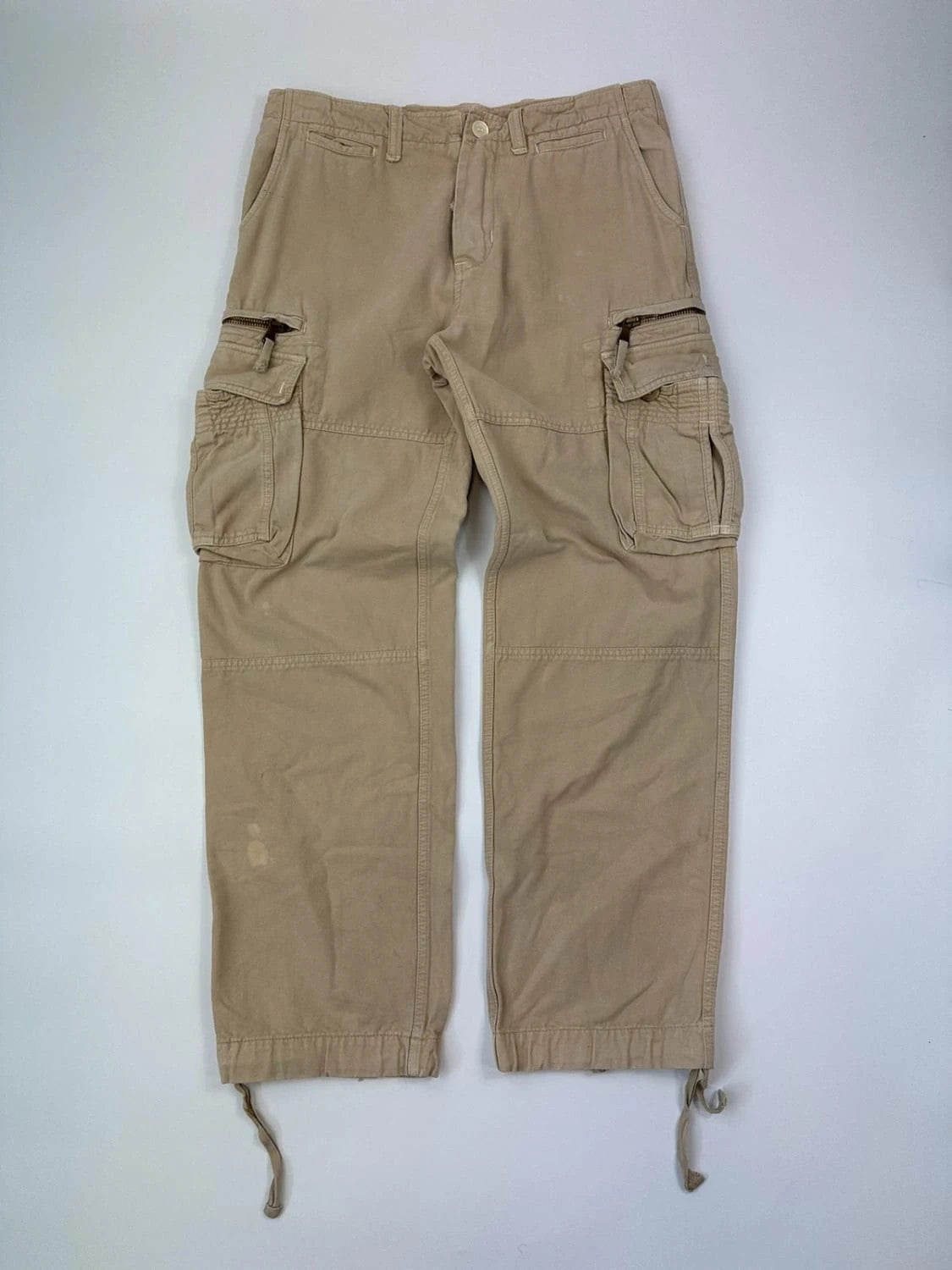 Dolce & Gabbana beige wide-leg trousers with logo on back pocket and adjustable drawstring.