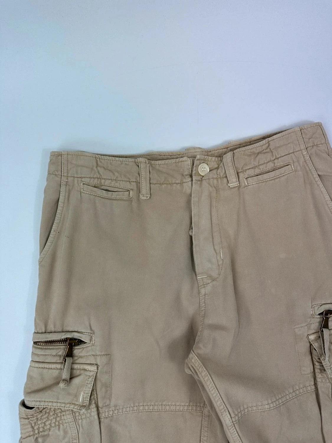 Dolce & Gabbana beige wide-leg trousers with logo on back pocket and adjustable drawstring.