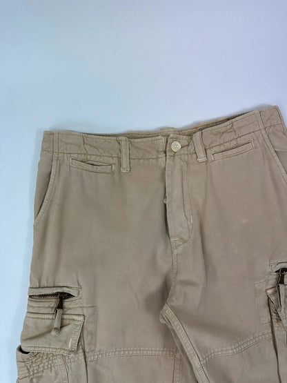 Dolce & Gabbana beige wide-leg trousers with logo on back pocket and adjustable drawstring.