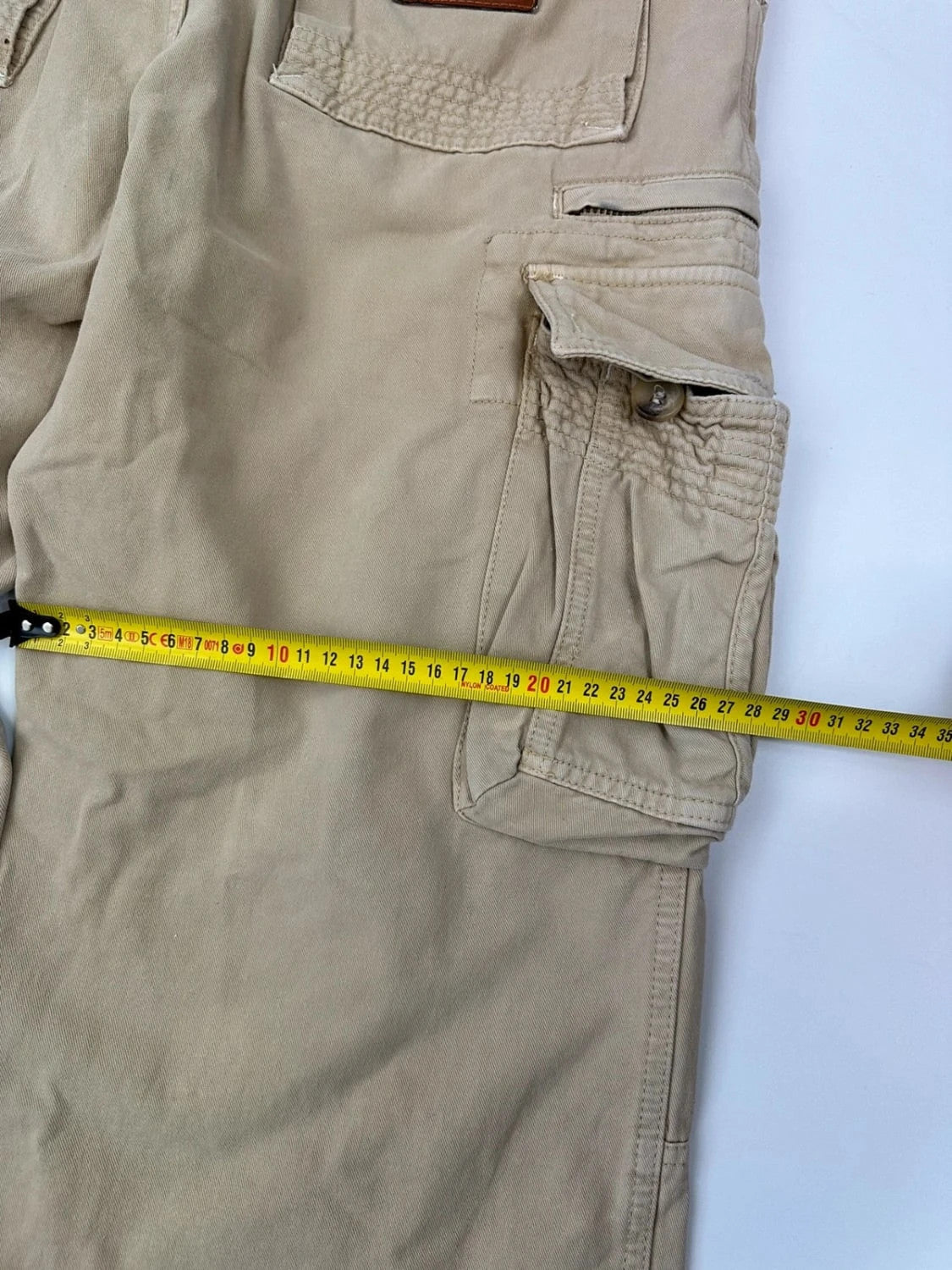 Dolce & Gabbana beige wide-leg trousers with logo on back pocket and adjustable drawstring.