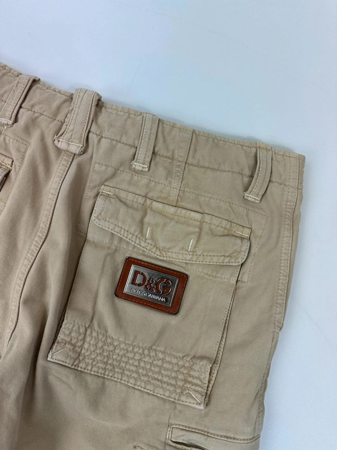 Dolce & Gabbana beige wide-leg trousers with logo on back pocket and adjustable drawstring.