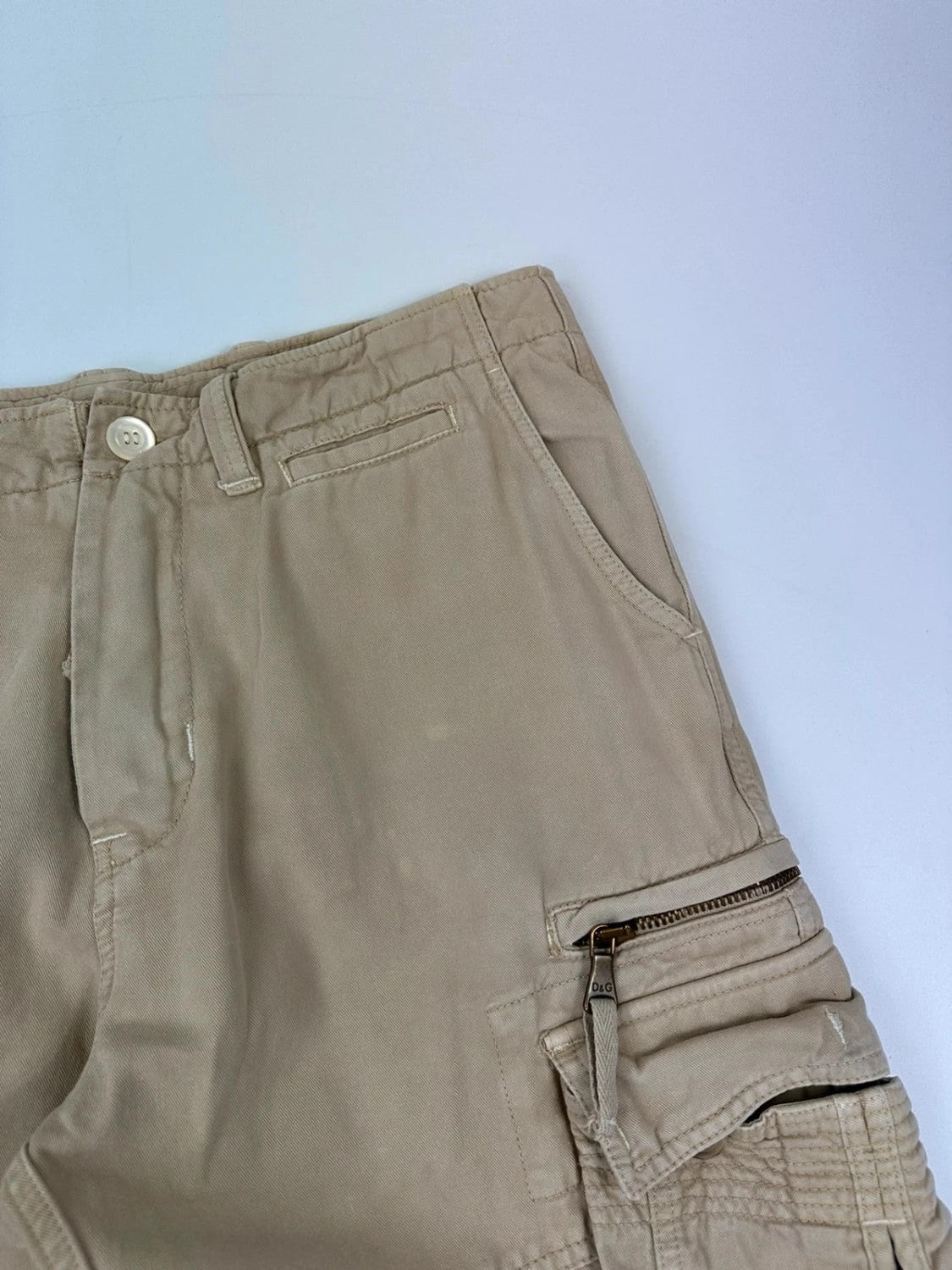 Dolce & Gabbana beige wide-leg trousers with logo on back pocket and adjustable drawstring.