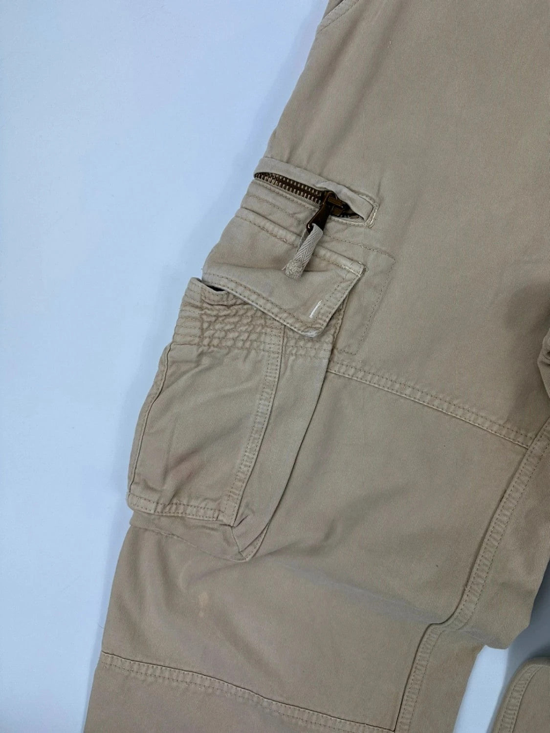Dolce & Gabbana beige wide-leg trousers with logo on back pocket and adjustable drawstring.