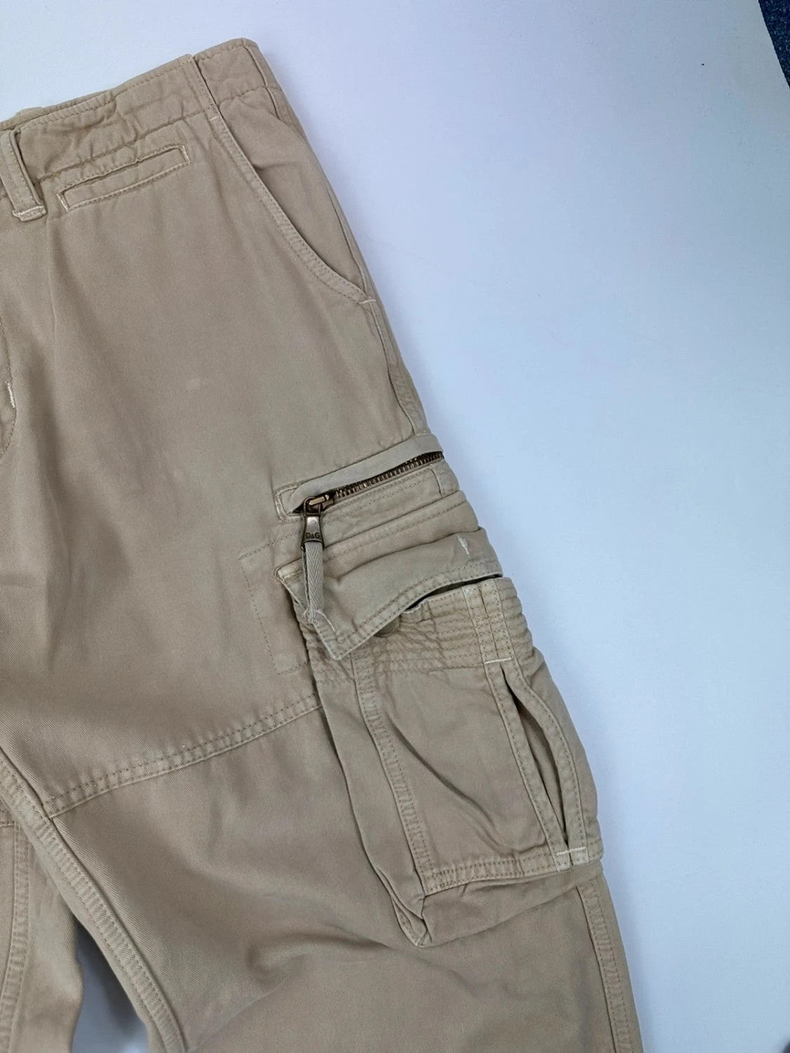 Dolce & Gabbana beige wide-leg trousers with logo on back pocket and adjustable drawstring.
