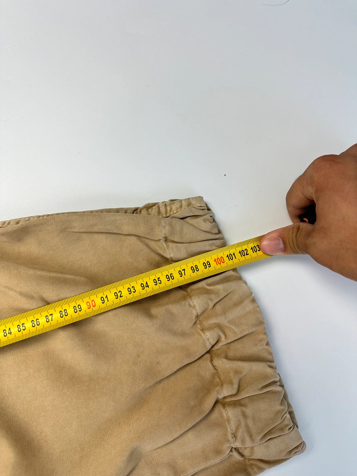 Dolce & Gabbana beige wide-leg trousers with cargo pockets and vintage 2003 design.
