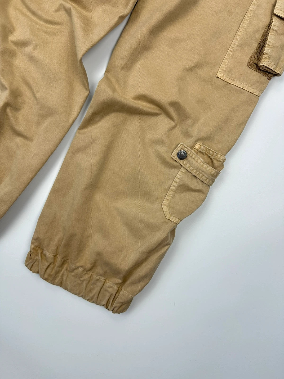 Dolce & Gabbana beige wide-leg trousers with cargo pockets and vintage 2003 design.