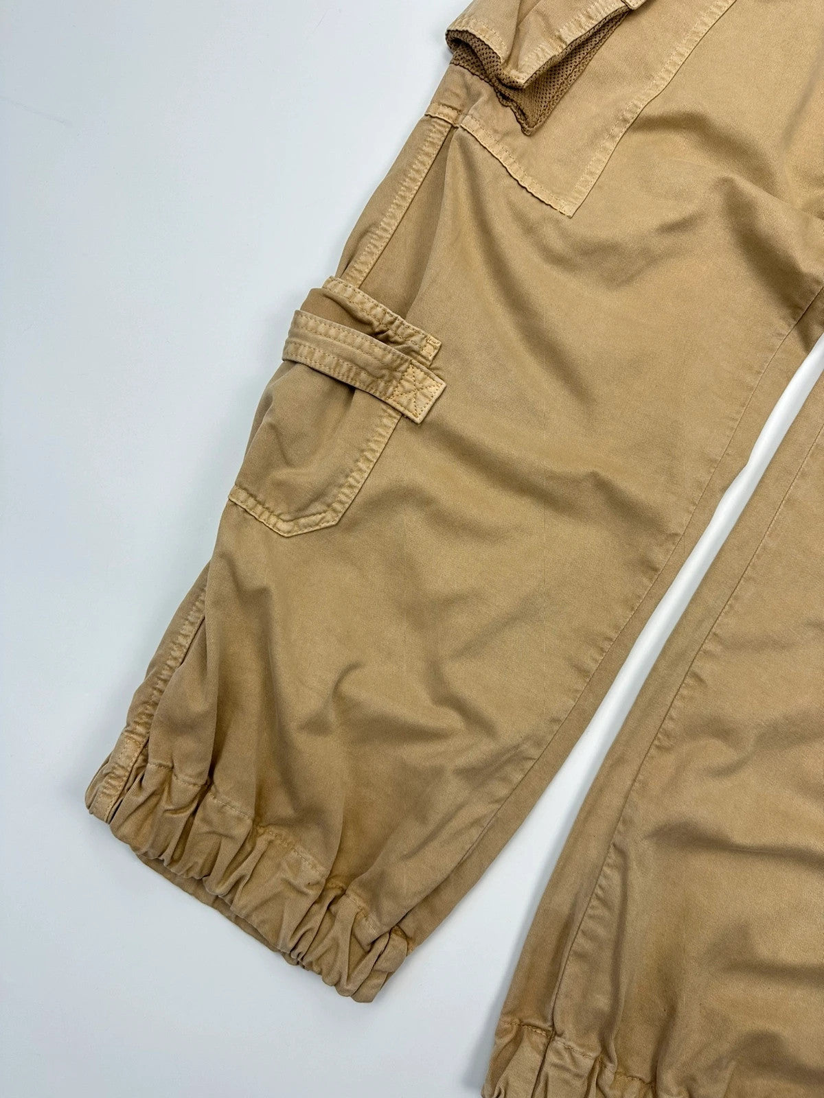 Dolce & Gabbana beige wide-leg trousers with cargo pockets and vintage 2003 design.