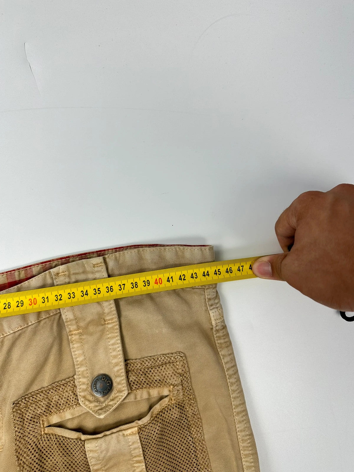 Dolce & Gabbana beige wide-leg trousers with cargo pockets and vintage 2003 design.