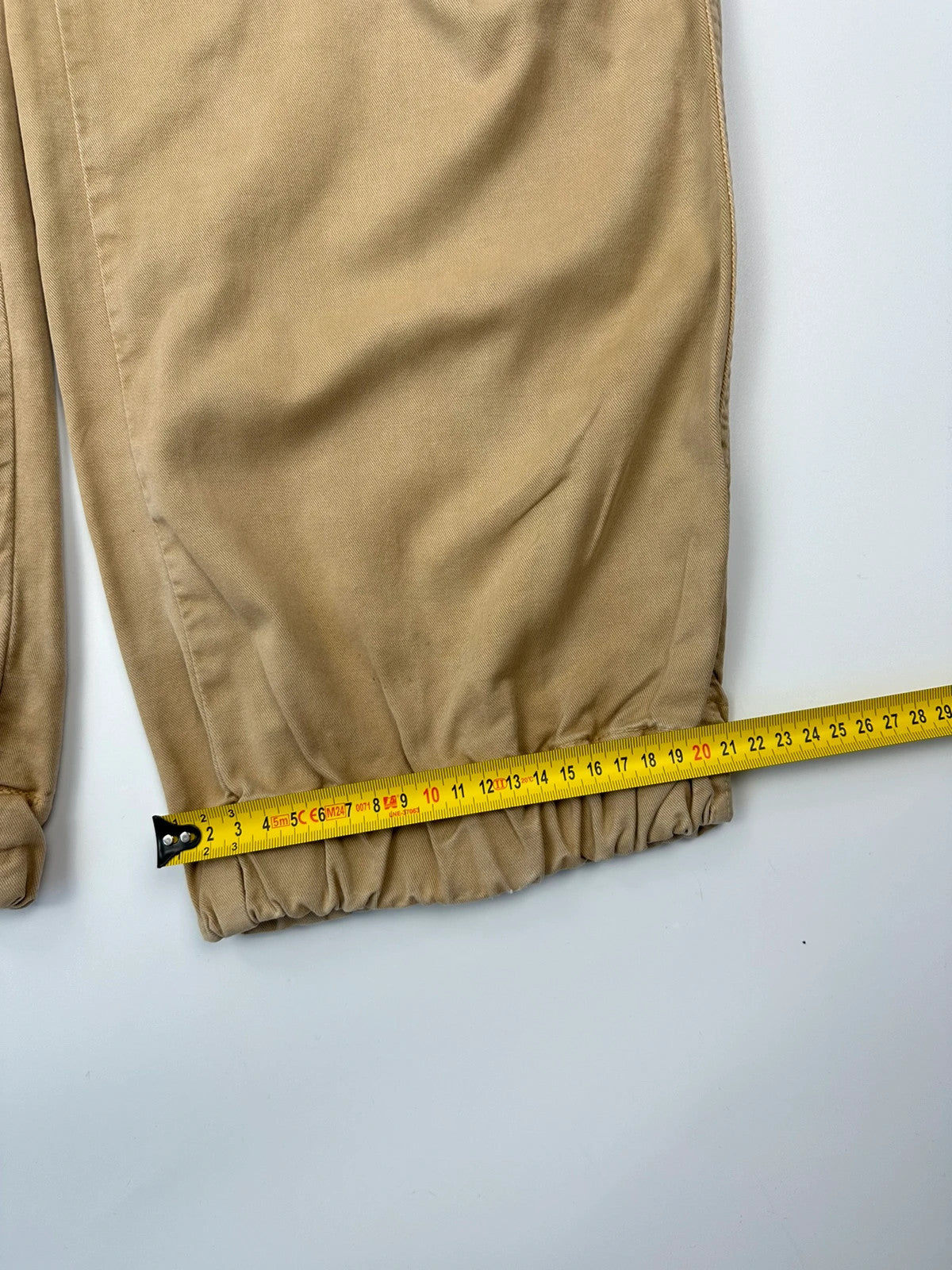 Dolce & Gabbana beige wide-leg trousers with cargo pockets and vintage 2003 design.