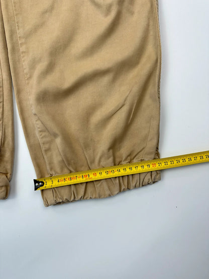 Dolce & Gabbana beige wide-leg trousers with cargo pockets and vintage 2003 design.
