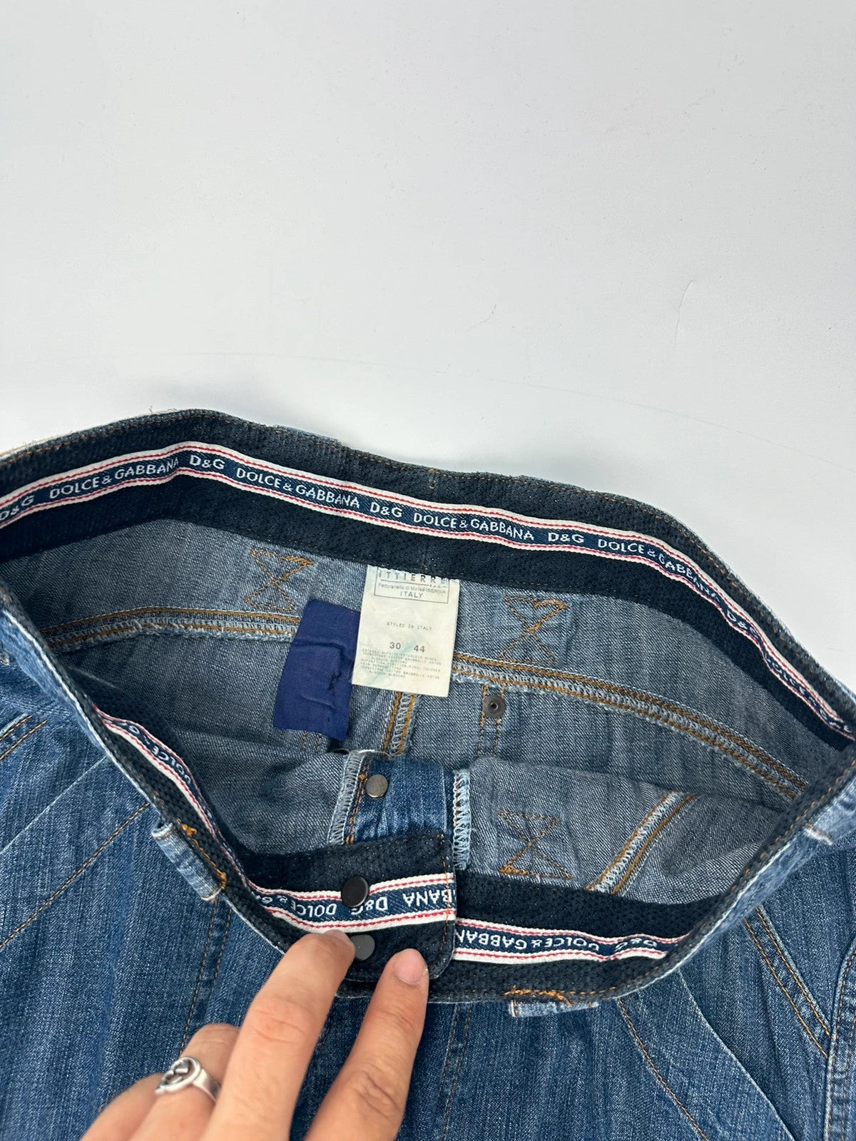 Dolce & Gabbana blue straight jeans with cargo pockets and mesh detailing from SS03 collection.