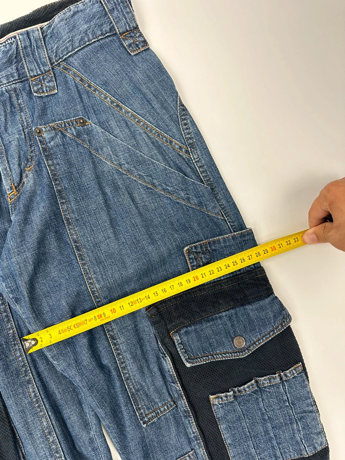 Dolce & Gabbana blue straight jeans with cargo pockets and mesh detailing from SS03 collection.