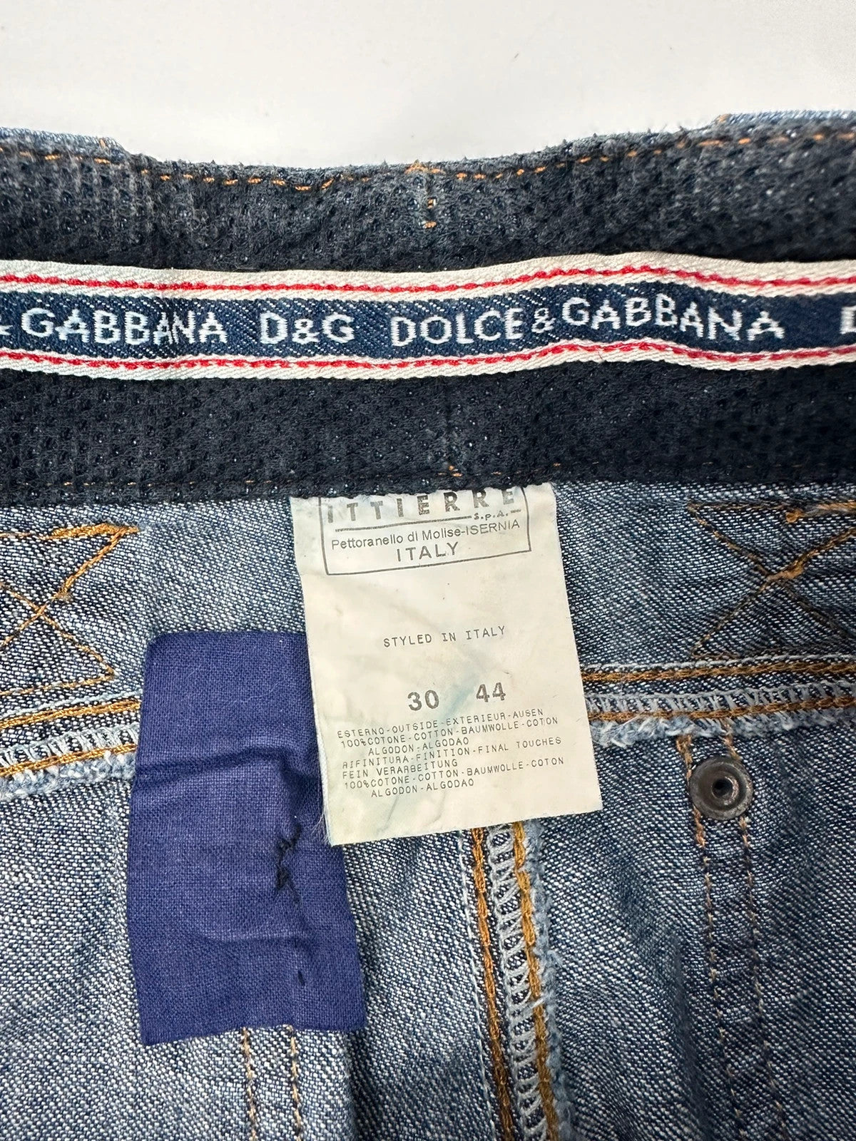 Dolce & Gabbana blue straight jeans with cargo pockets and mesh detailing from SS03 collection.