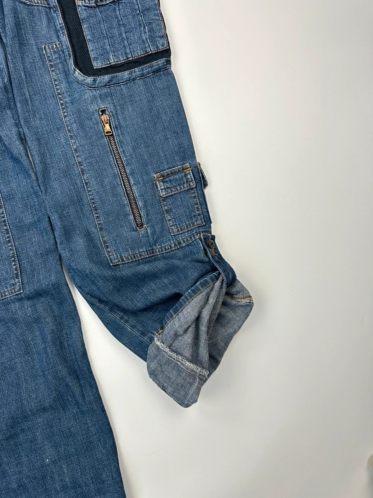 Dolce & Gabbana blue straight jeans with cargo pockets and mesh detailing from SS03 collection.