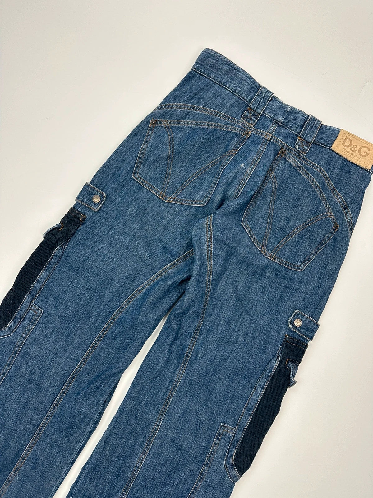 Dolce & Gabbana blue straight jeans with cargo pockets and mesh detailing from SS03 collection.