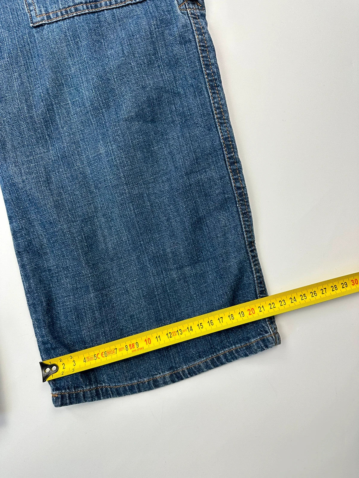 Dolce & Gabbana blue straight jeans with cargo pockets and mesh detailing from SS03 collection.
