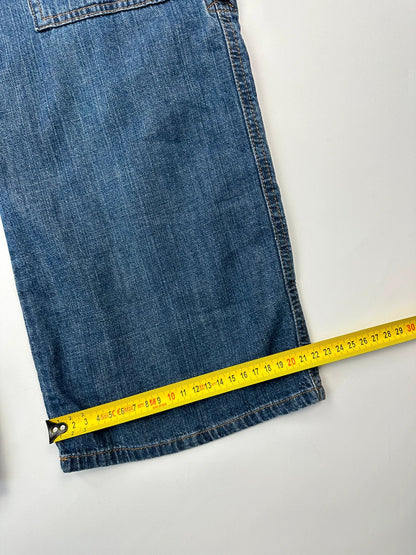Dolce & Gabbana blue straight jeans with cargo pockets and mesh detailing from SS03 collection.