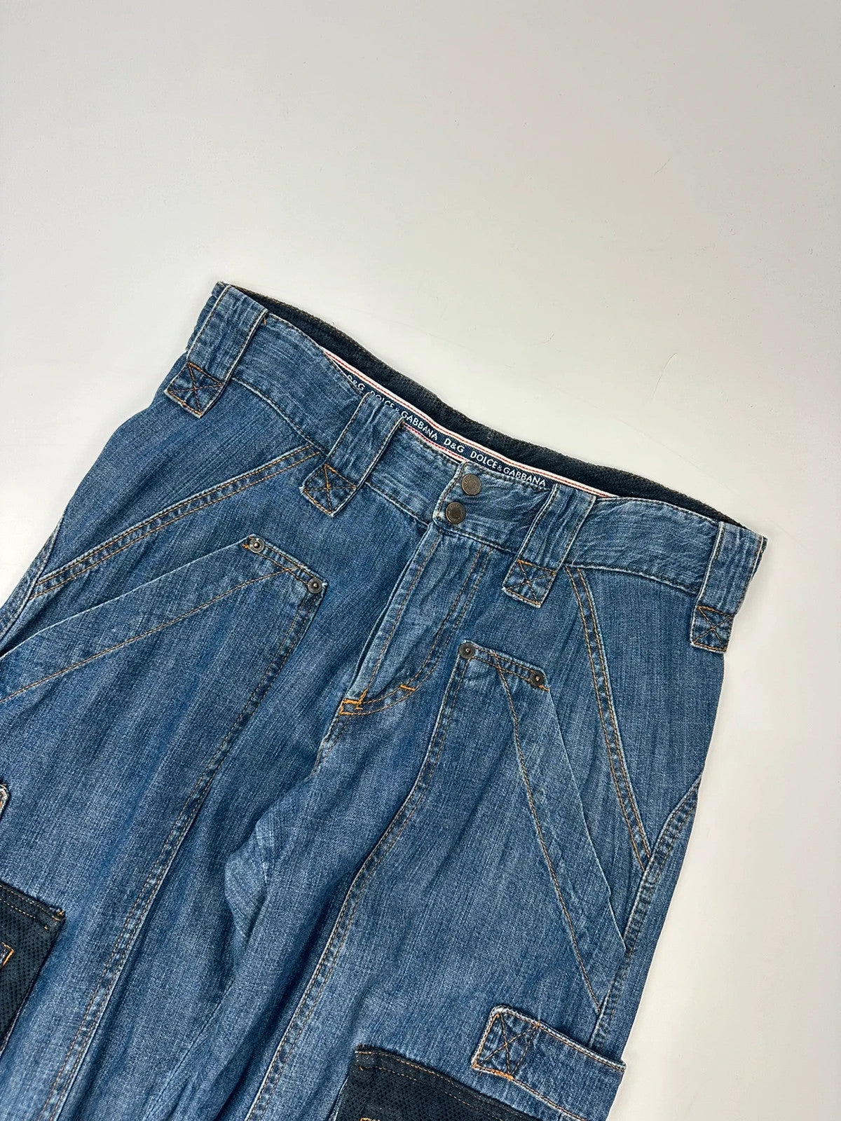 Dolce & Gabbana blue straight jeans with cargo pockets and mesh detailing from SS03 collection.