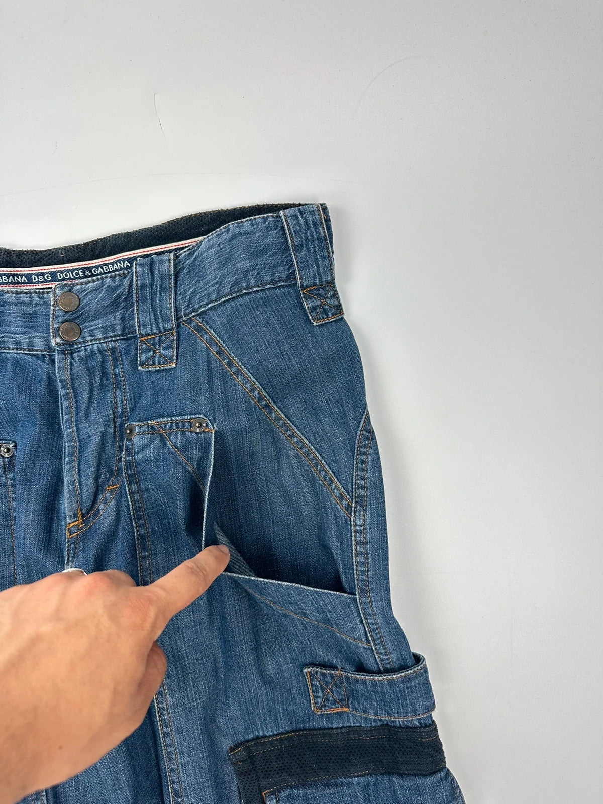 Dolce & Gabbana blue straight jeans with cargo pockets and mesh detailing from SS03 collection.