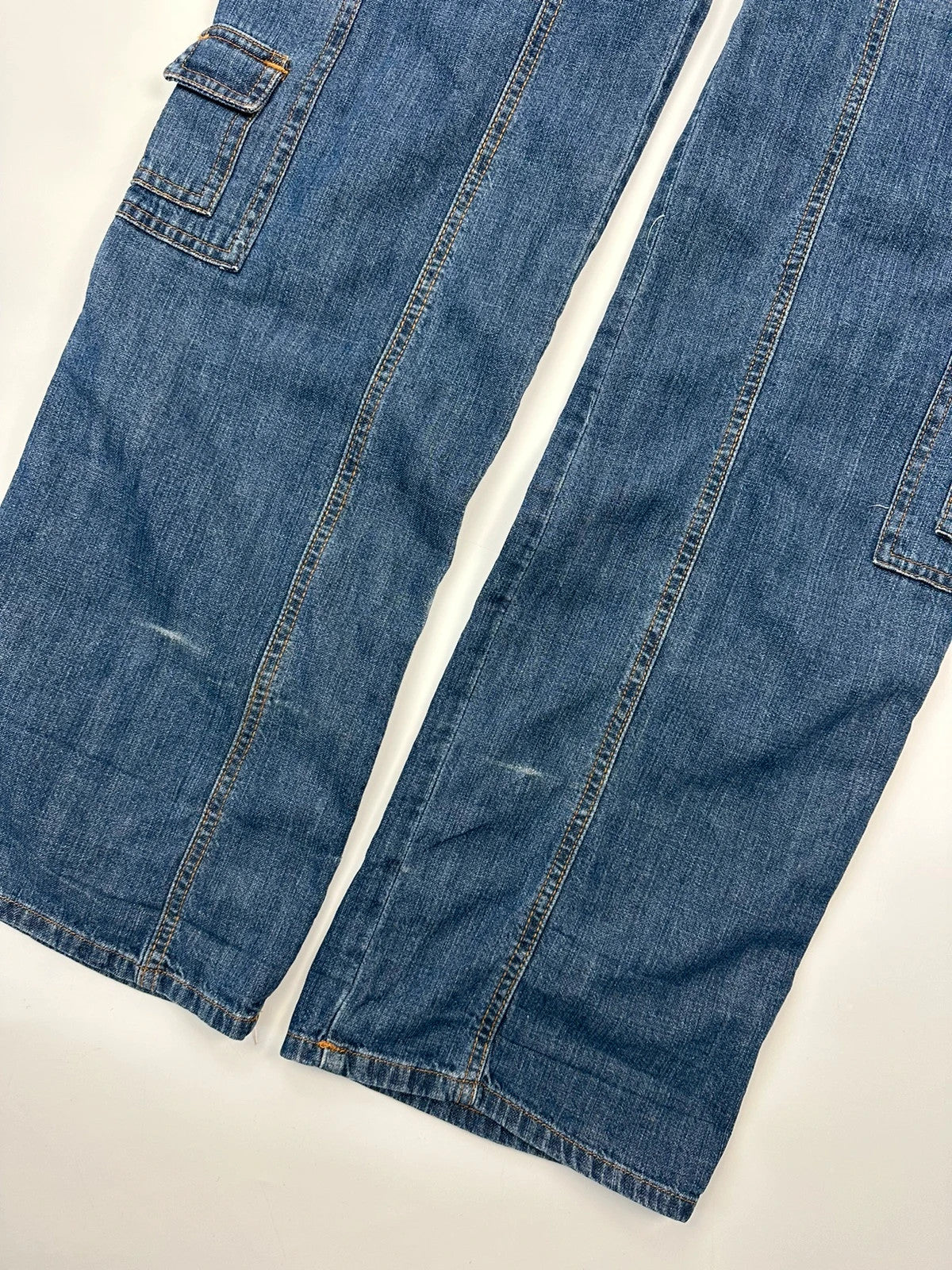 Dolce & Gabbana blue straight jeans with cargo pockets and mesh detailing from SS03 collection.