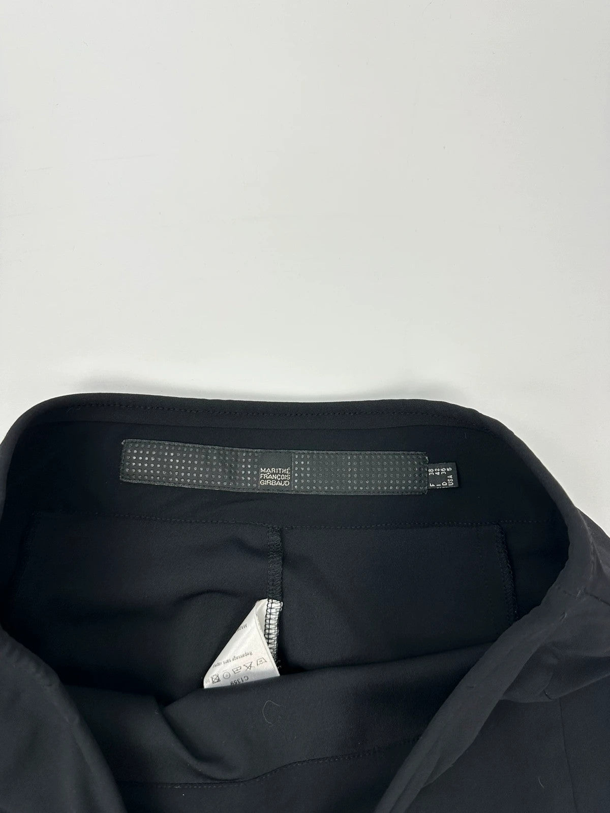 Marithé Francois Girbaud black mini skirt with double zip detail at the back.