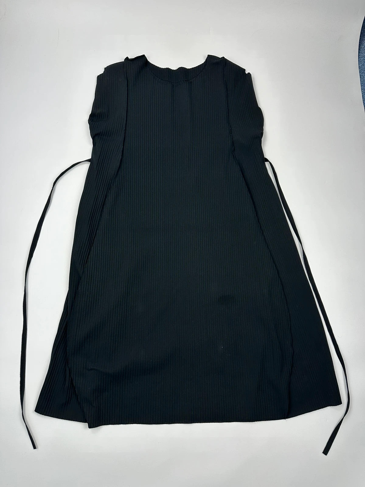 Issey Miyake black linen maxi dress with pleated design and unique string details.