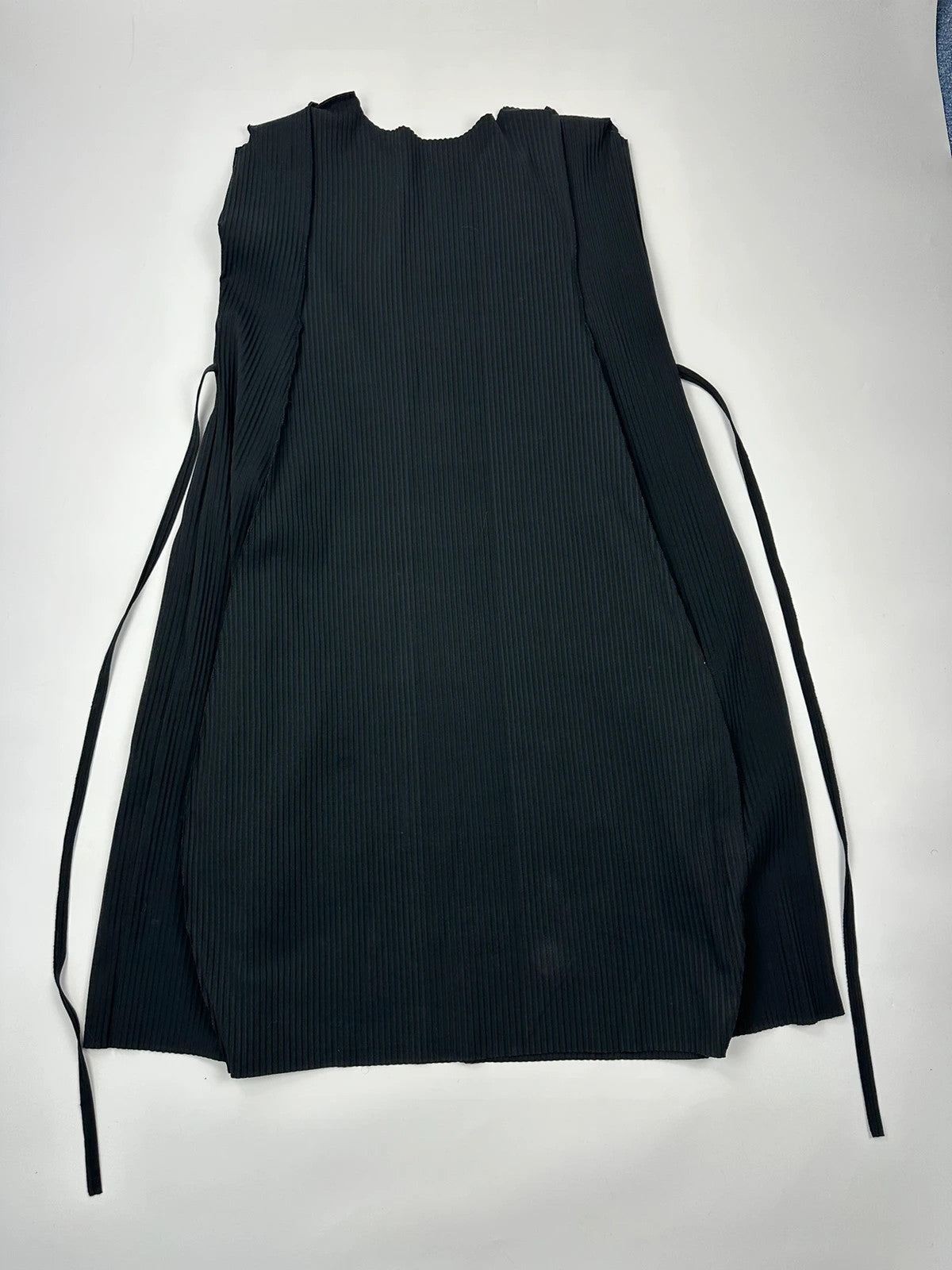 Issey Miyake black linen maxi dress with pleated design and unique string details.