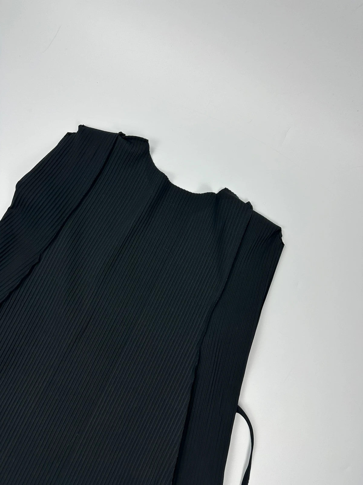 Issey Miyake black linen maxi dress with pleated design and unique string details.