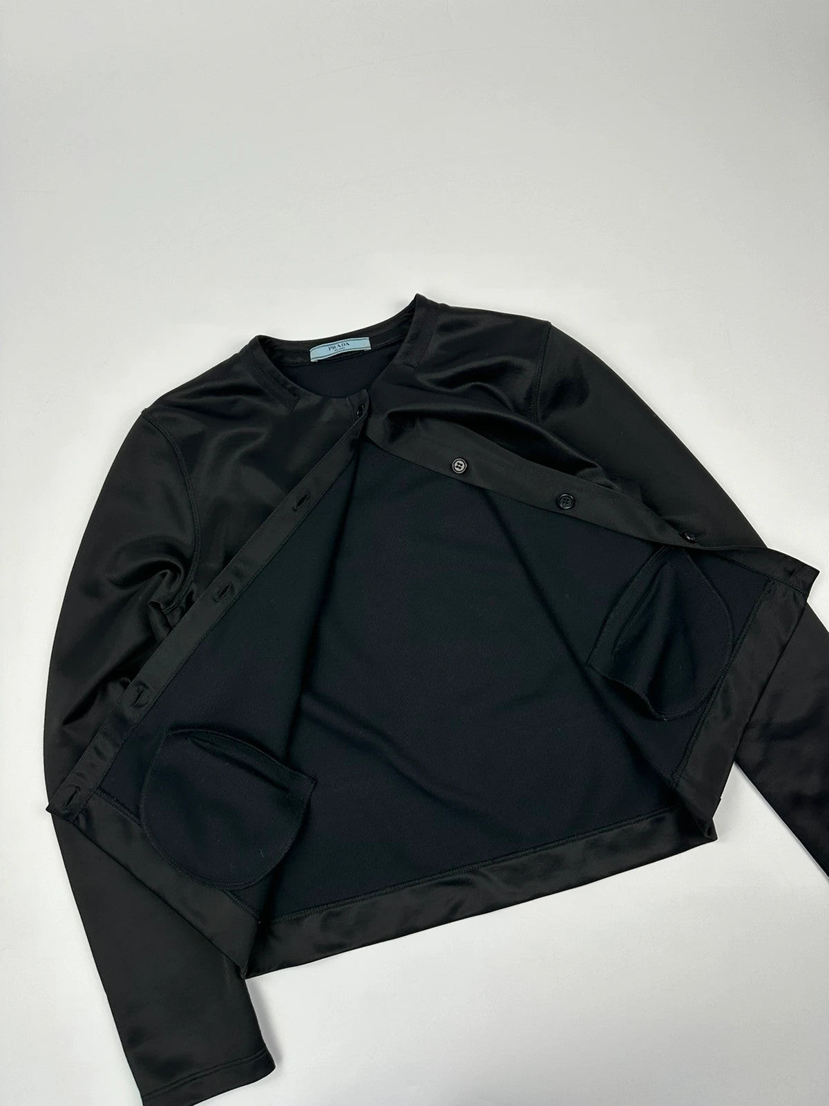 Prada black silk button-up jacket with rounded collar from SS2010 collection.
